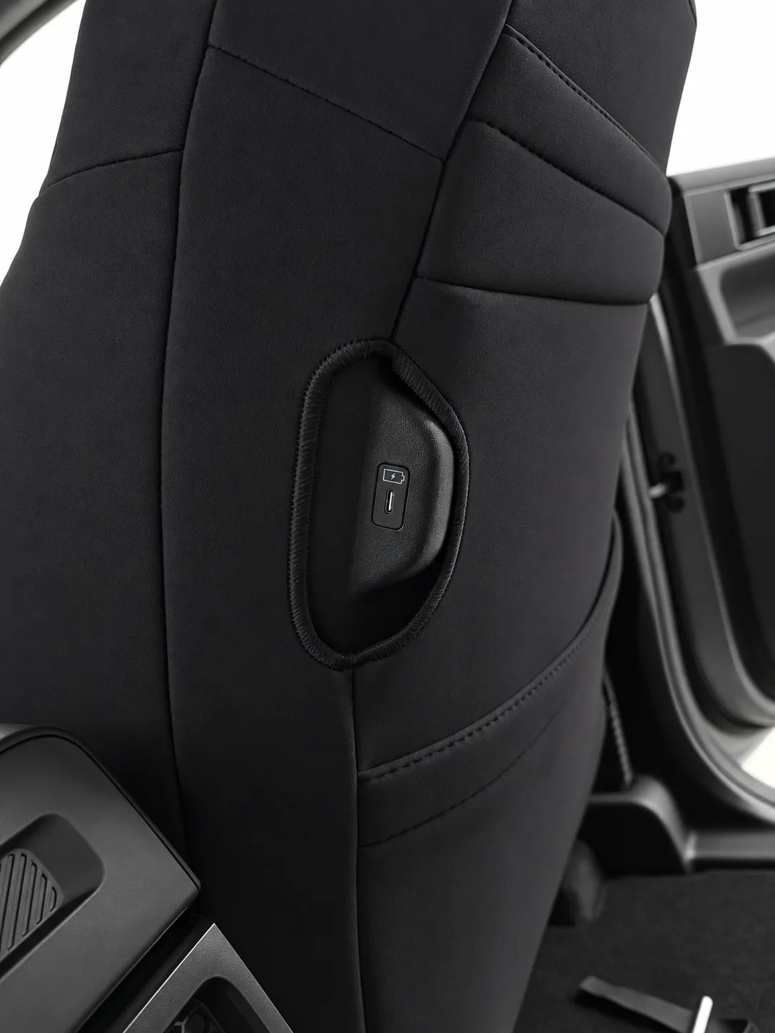 Kia Tasman S/SX/SX+ neoprene car seat covers view of drivers side charging port